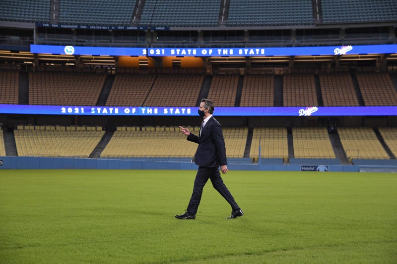 Gov. Gavin Newsom walks off the field at Dodger Stadium in Los Angeles following Tuesday's State of the State address.