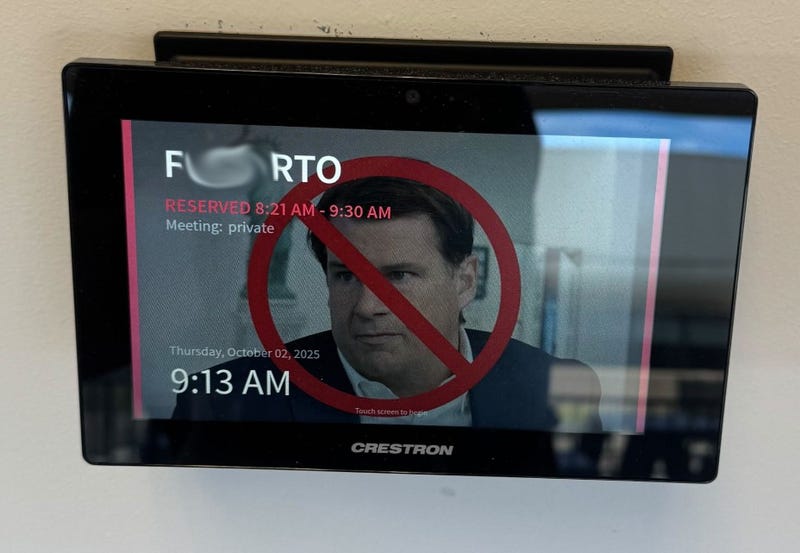 This photo of a message on a screen at Ford in Dearborn has been blurred to obscure profanity. 