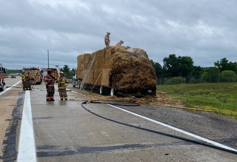 Motorists traveling out in West Michigan were told to steer clear of a major freeway in Kent County after a tractor trailer loaded down with hay suddenly caught fire on Saturday morning.