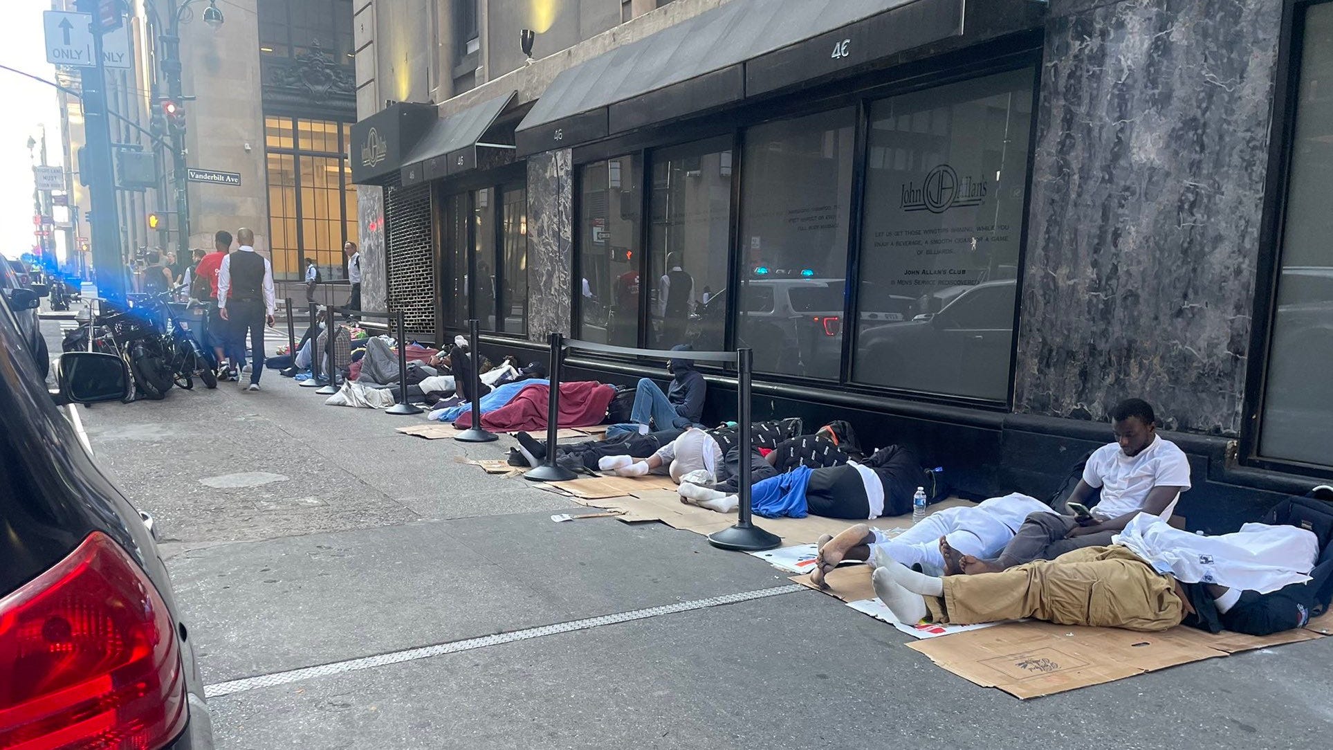 Hundreds of migrants sleep outside Roosevelt Hotel as space runs out; some try to force way inside