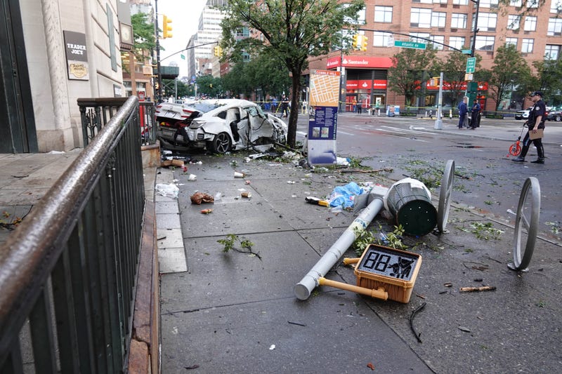 The Honda and a pedestrian crossing sign landed outside the Trader Joe's