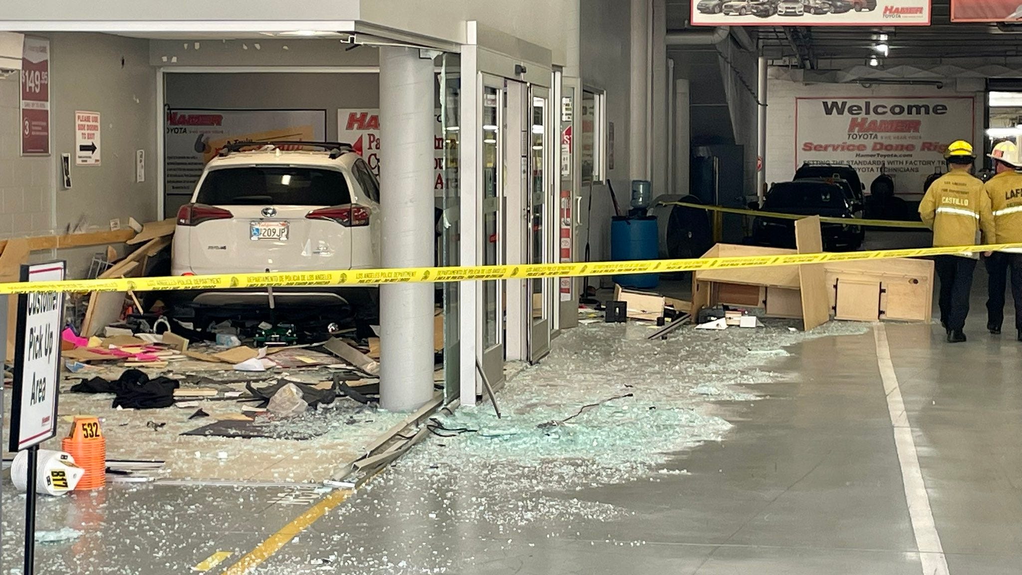 One dead after driver crashes into Mission Hills car dealership