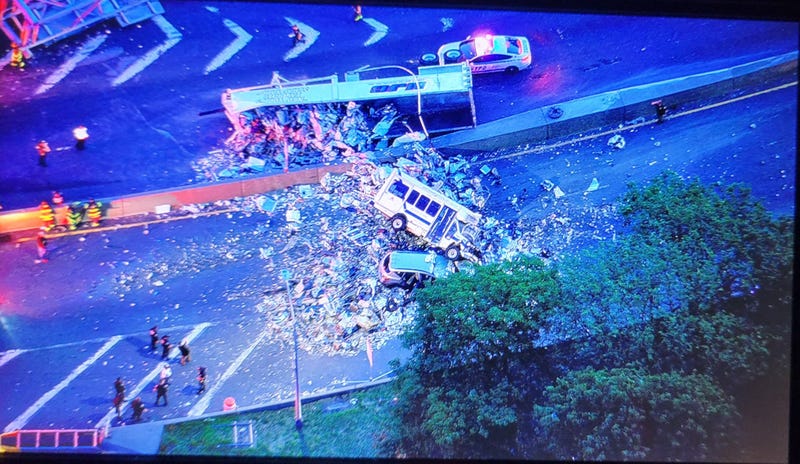 Scrap metal and other debris littered the roadway as traffic piled up for hours