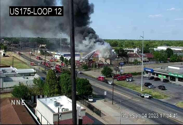 Firefighters battle a blaze along Bucker Boulevard on Monday, Sept. 4, 2023.