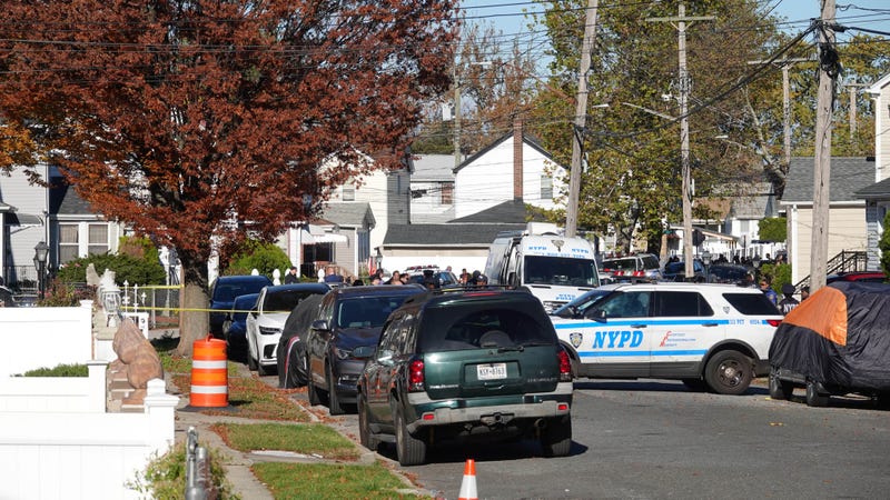 Police flooded the neighborhood Tuesday to investigate the triple killing