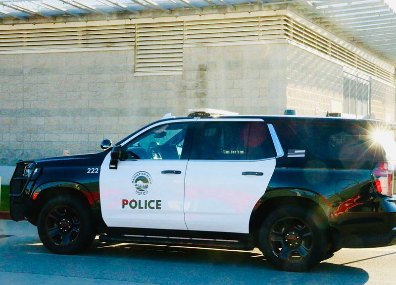 Manhattan Police Department car waiting outside Harbor-UCLA Medical Center where an officer died following a crash on the 405