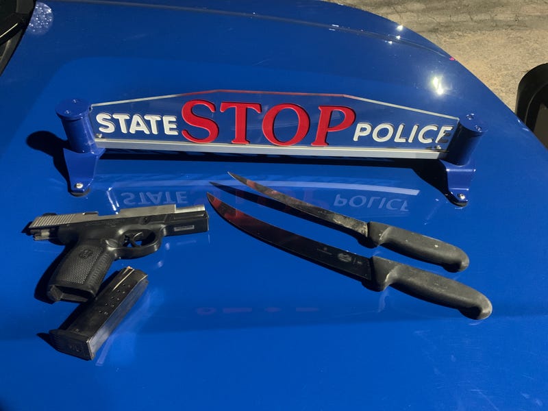 Two knifes and a gun