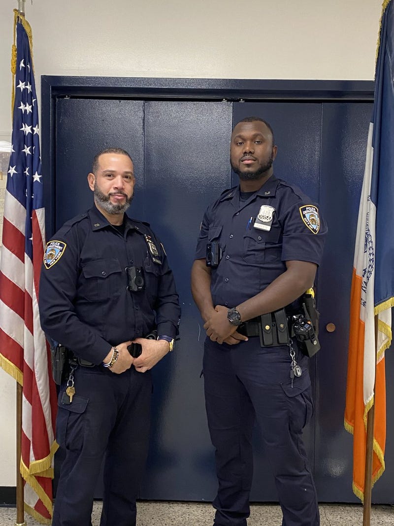 Officer Carl Fayette and Officer Eleodoro J. Mata from the 26th Precinct.