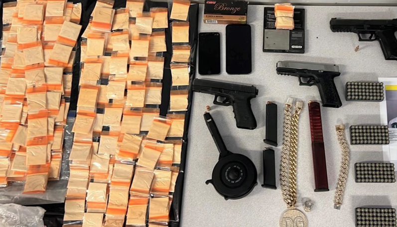 drug baggies, guns, chains, and bullets