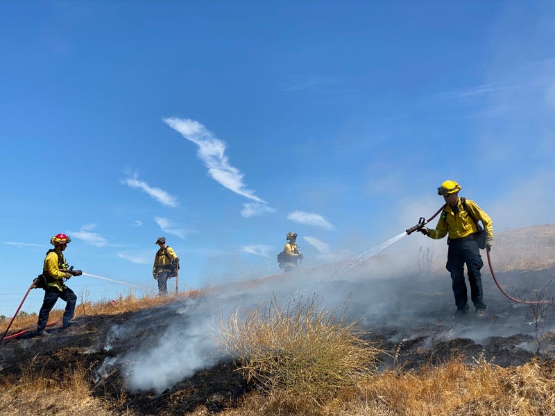 Contra Costa County firefighters demonstrate how quickly "safe and sane" fireworks can lead to larger fires in dry grass.