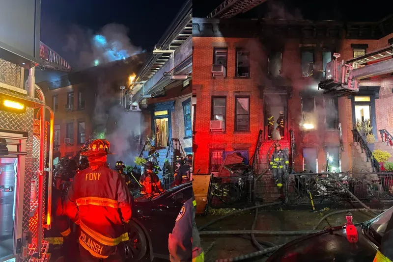 A three-alarm fire raged in Brooklyn early this morning.