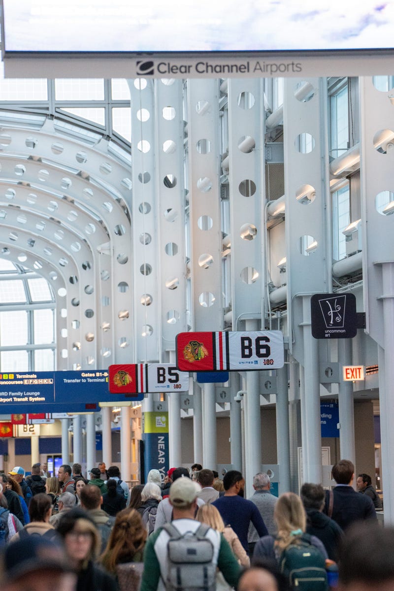 United Airline's B and C gates are also showing support for the Blackhawks with signage featuring the team's logo and a smaller centennial logo.