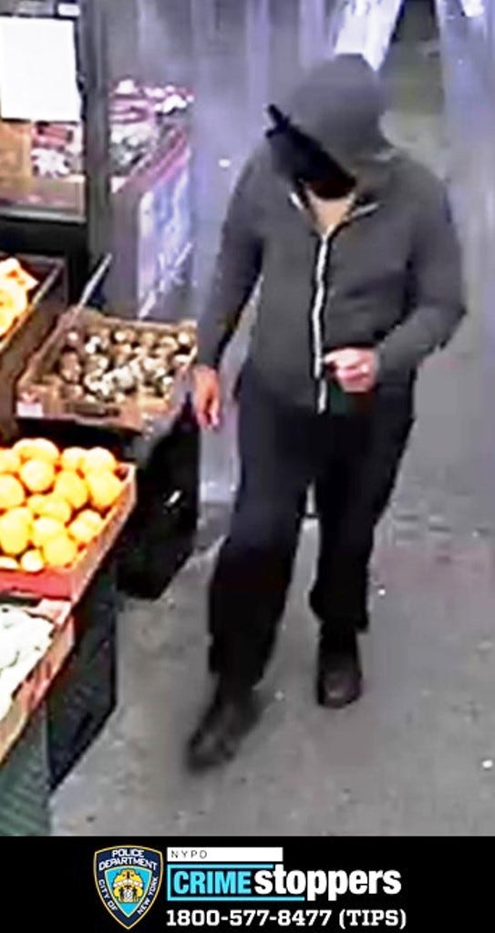 The suspect was observed wearing a grey hooded sweatshirt, black pants, black sneakers, tan t-shirt and a black balaclava mask.