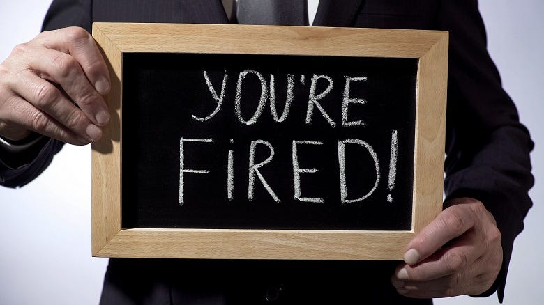 "You're Fired" written on chalk board 