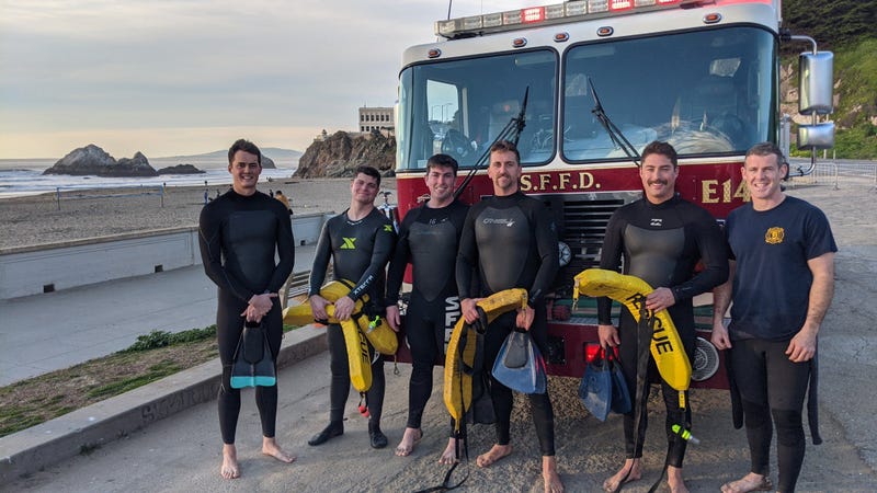 The San Francisco Fire Department has shared a photo of the rescue swimmers who saved three surfers on Saturday amid Tsunami Advisory conditions.