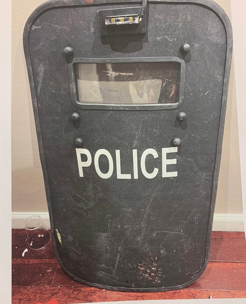 Police said the injured detective held up his ballistic shield to protect the rest of his team as pressure was applied to his bleeding leg wound