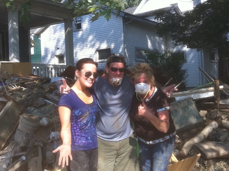 Lissa, Rocky & Sue helping flood victim