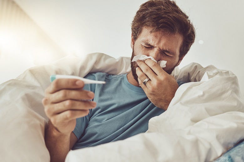 man sick in bed