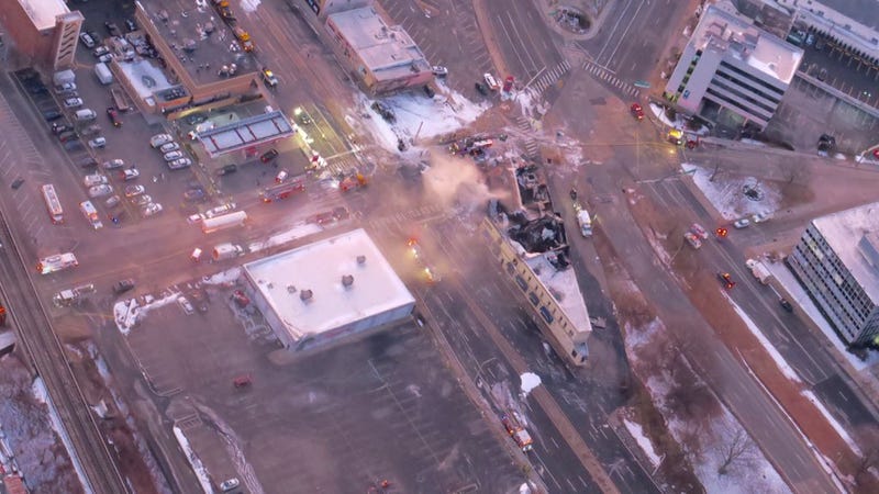 Firefighters were still dousing pockets of fire and smoke at sunrise Wednesday