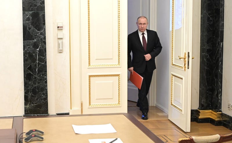 Russian President Vladimir Putin arrives at a meeting with members of Russia's Security Council