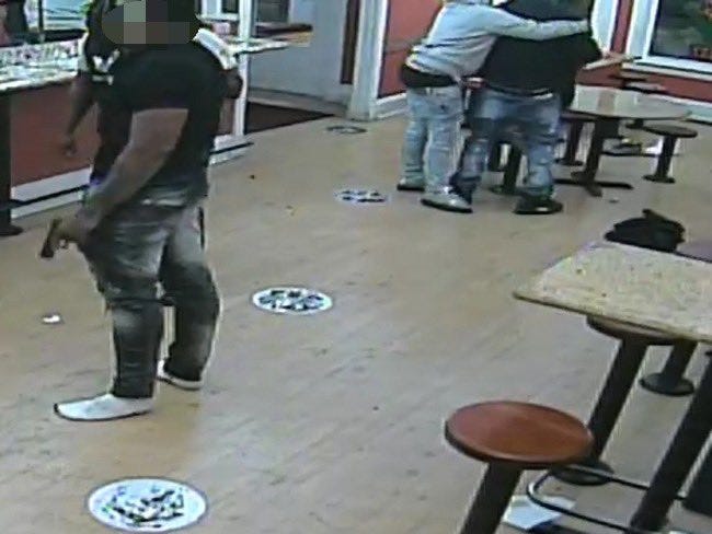 An image of the fight and struggle over a handgun that occurred inside the La Victoria Restaurant.