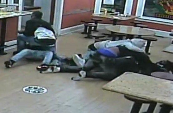 An image of the fight and struggle over a handgun that occurred inside the La Victoria Restaurant.