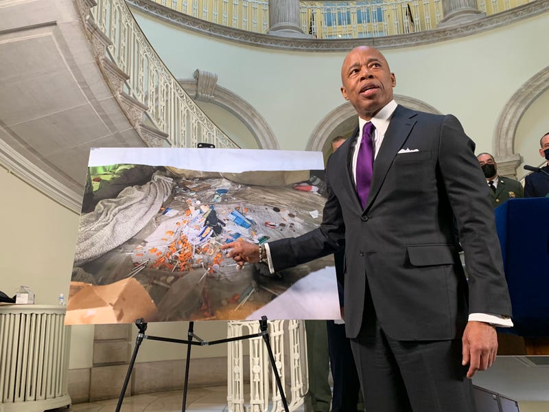 Mayor Adams points to an encampment where he said 500 hypodermic needles were found
