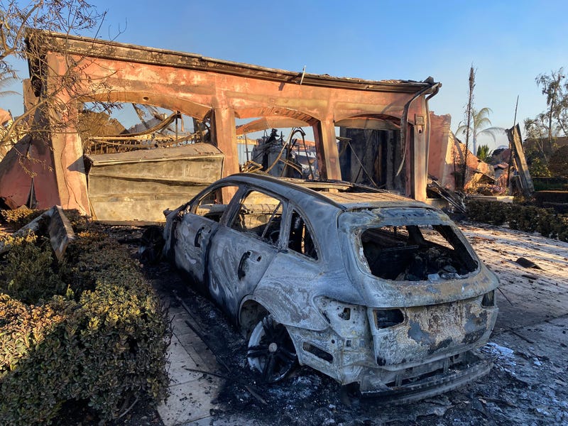Dozens of multi-million dollar homes have been destroyed after a wildfire ripped through an upscale community in Orange County Wednesday.