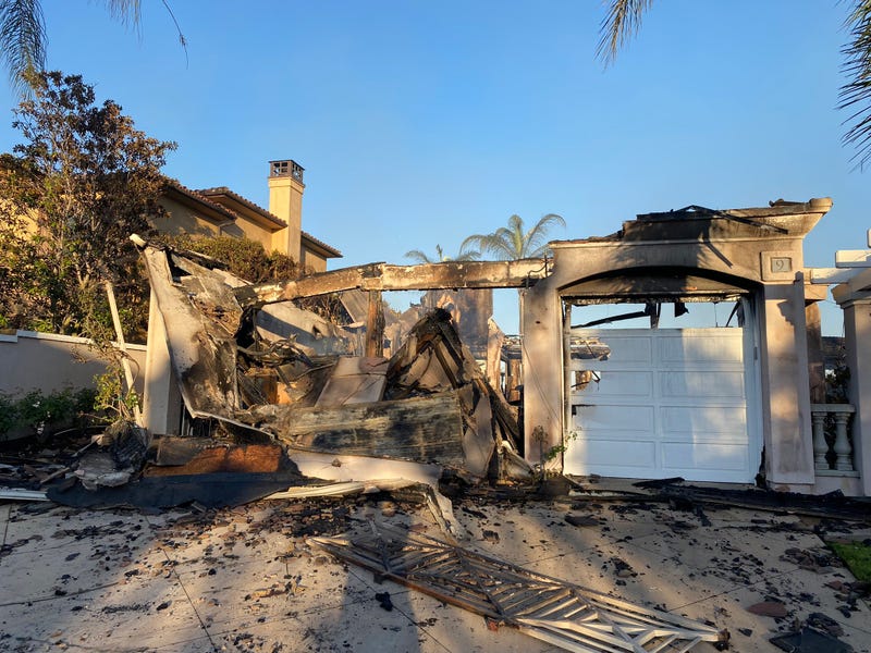 Dozens of multi-million dollar homes have been destroyed after a wildfire ripped through an upscale community in Orange County Wednesday.