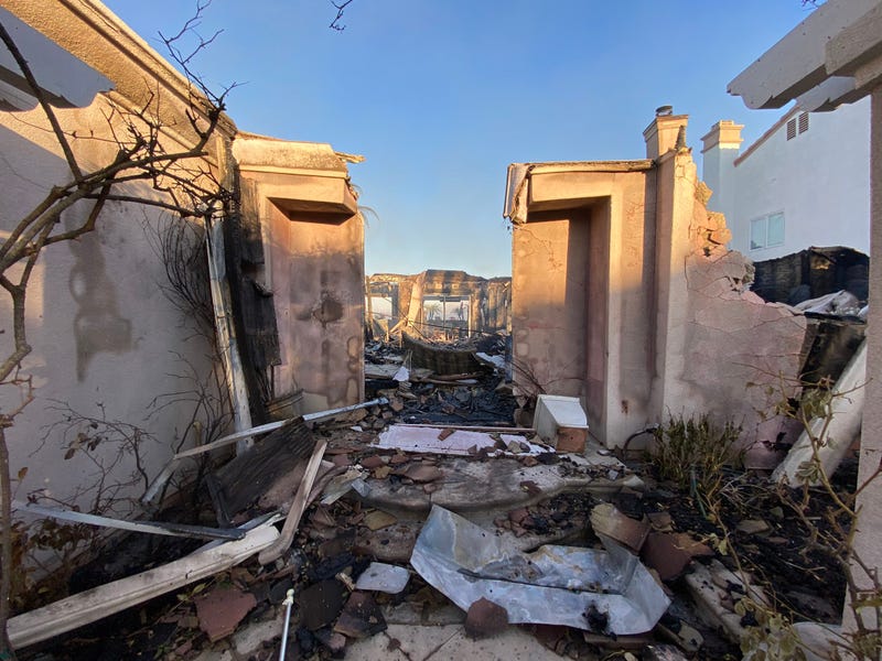 Dozens of multi-million dollar homes have been destroyed after a wildfire ripped through an upscale community in Orange County Wednesday.