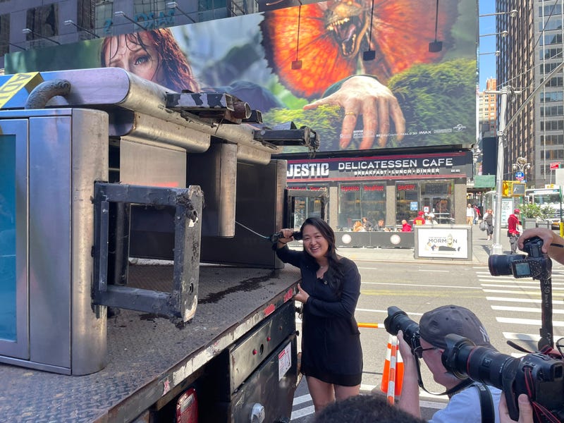 Queens Councilmember Julie Won says goodbye to the city’s last public payphone at Seventh Avenue and W. 50th Street on Monday