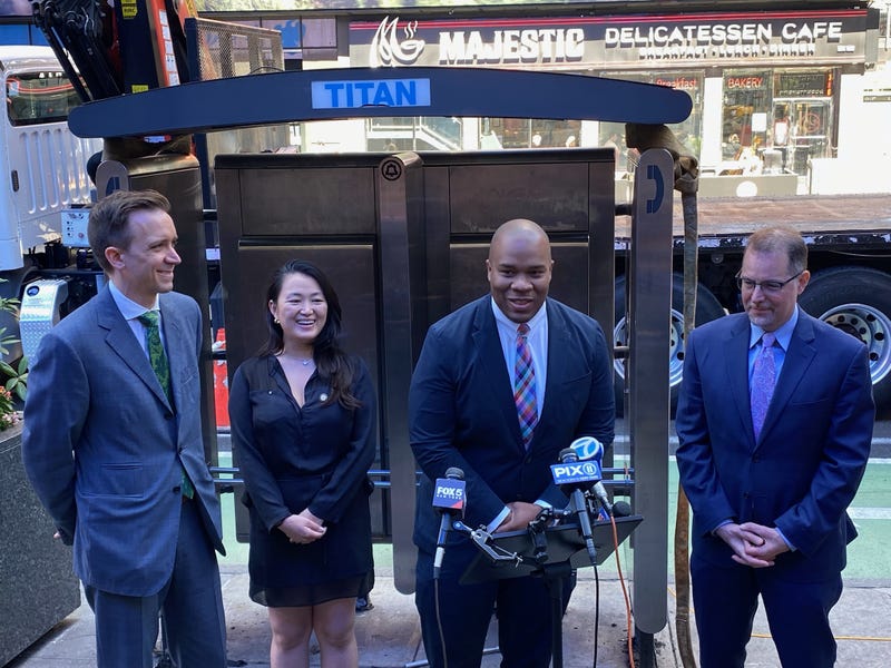 NYC Chief Technology Officer Matthew Fraser (second from right) at a ceremony removing the payphone on Monday