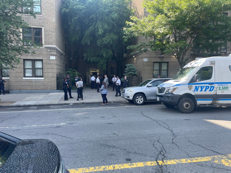 Police were seen outside of the off-duty officer's apartment building in the Concourse Village section on Monday morning