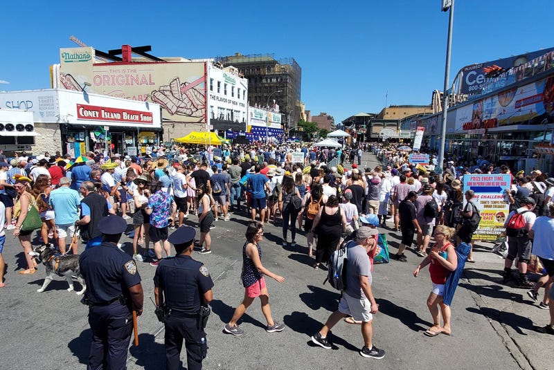 The hot dog eating contest was back at its traditional location outside Nathan’s flagship shop in Coney Island on Monday