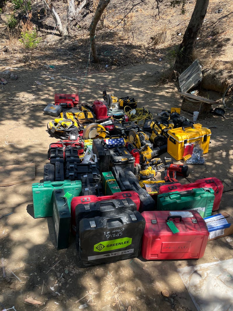 Police have arrested six suspects after finding a bunker full of stolen goods at a homeless encampment in San Jose.