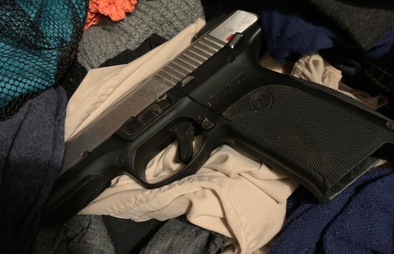 One Macomb County man is in police custody after he allegedly discharged a pistol through the wall of his home during a drunken dispute with a woman early Friday morning.