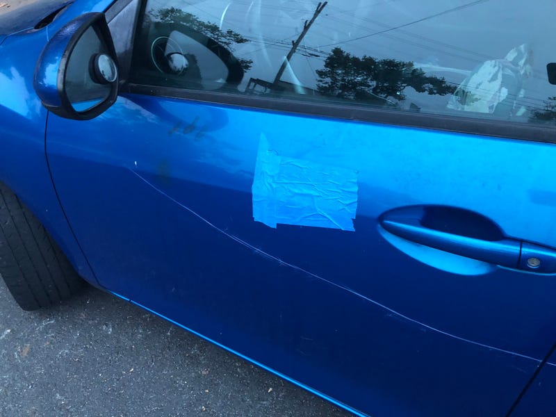 Tuesday morning, the swastikas had mostly been covered over by tape or cardboard. 
