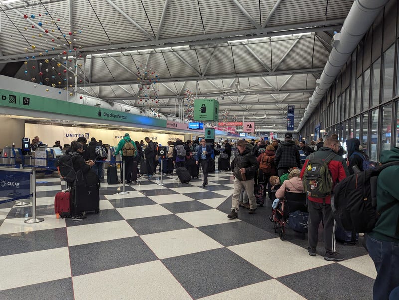 travelers at O'Hare Airport