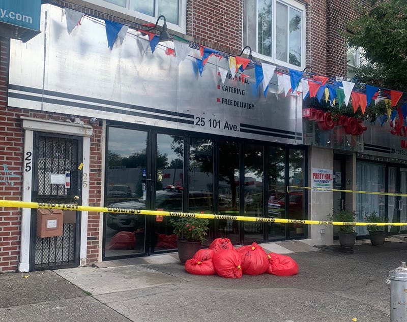 Hazmat bags outside of the apartment on Thursday morning. The FBI cordoned off the entire block