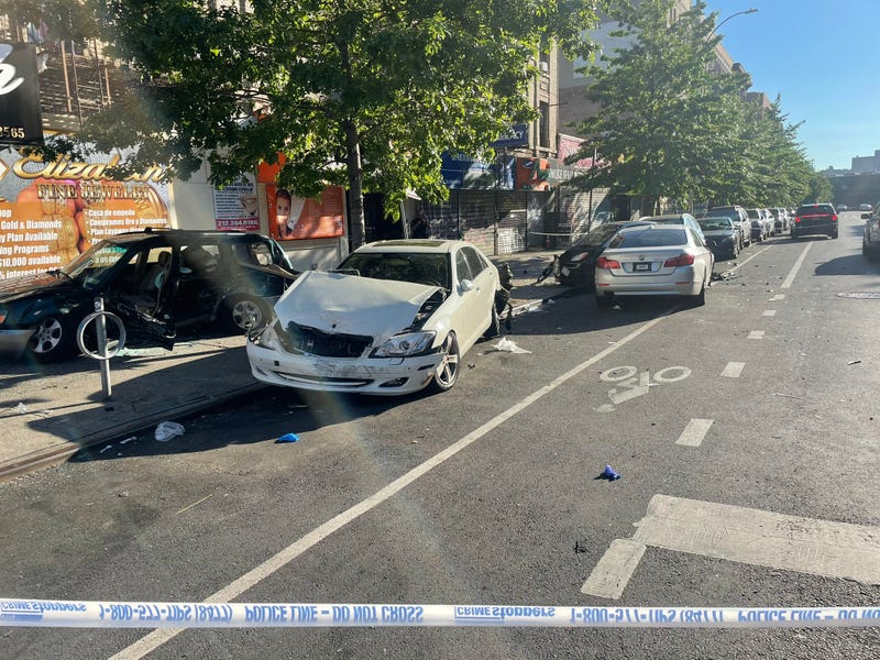 At least five vehicles appeared to be damaged as police investigated at Sherman Avenue and W. 207th Street in Inwood on Wednesday morning