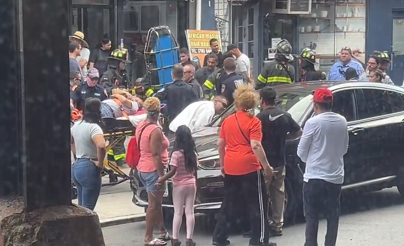 Citizen App footage shows an injured person near cellar doors on Broadway and West 232nd Street in the Bronx being aided by EMS and fire officials.