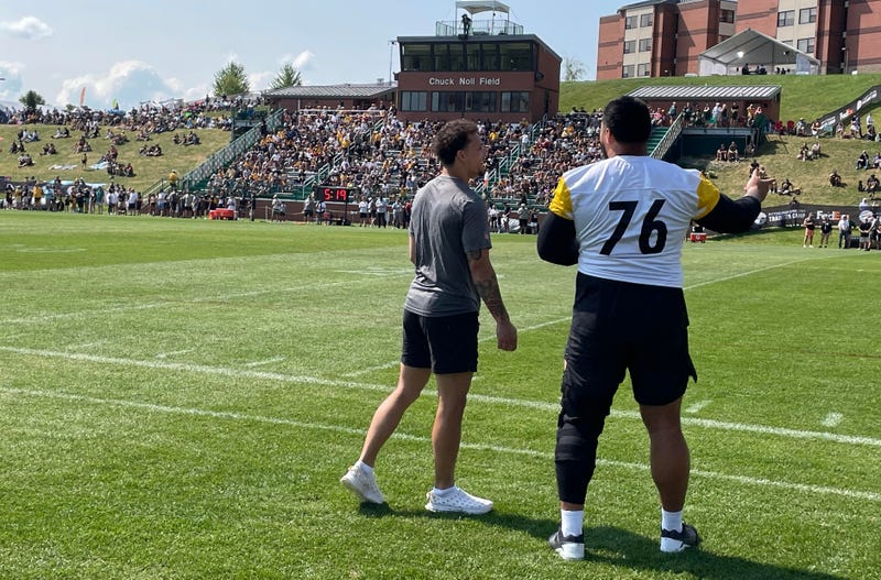 Troy Fautanu and Roman Wilson watching practice in Latrobe