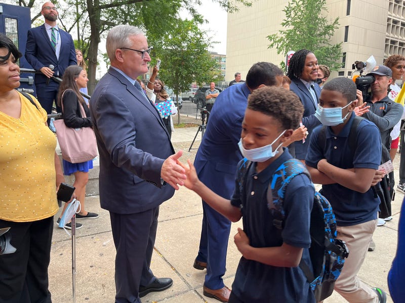 Philadelphia Mayor Jim Kenney high-fives students are they enter Dunbar School on their first day back of the 2022-23 year, Aug. 29, 2022.