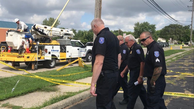 Two brothers are hopsitalized after coming into contact with live wire outside a school in Warren on Tuesday morning, officials confirmed.