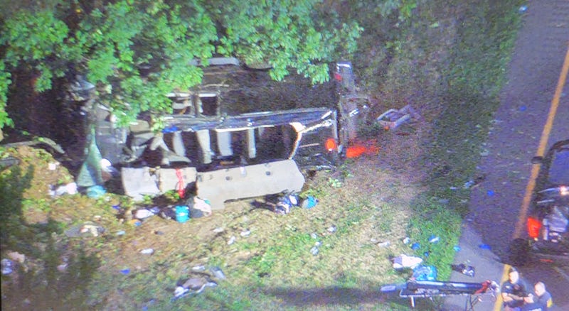 The passenger van overturned near Exit 1 in the southbound Palisades Parkway in Englewood Cliffs