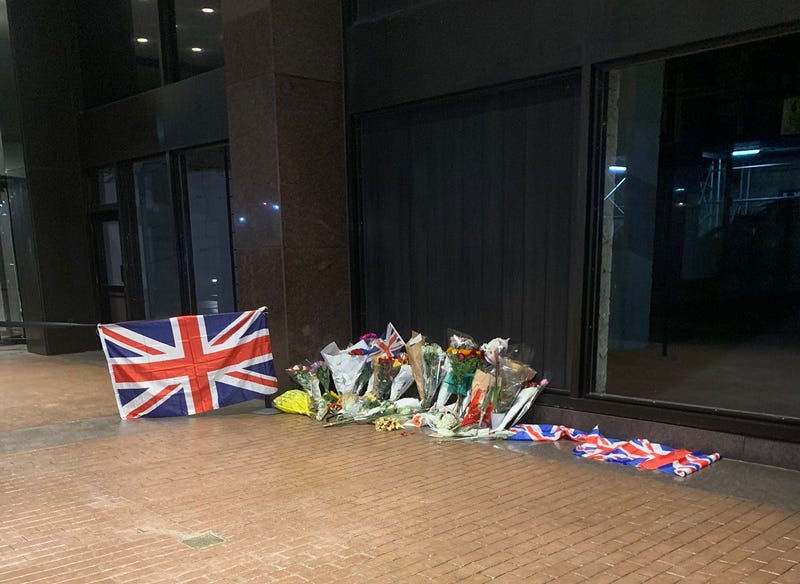 Mayor Adams and other New Yorkers laid flowers outside the British Consulate at Hammarskjold Plaza in Turtle Bay on Friday