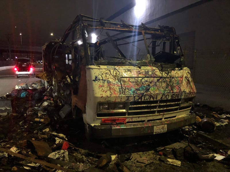 Nearly a dozen vehicles caught fire Tuesday morning under Interstate-880 in Oakland at a large homeless encampment.