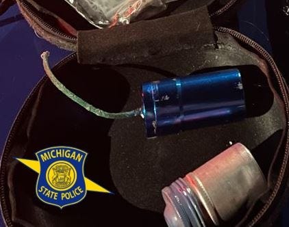 A hunch by troopers in Northern Michigan proved right after they conducted a traffic stop on a suspected drug deal and found not only drugs, but firearms and a homemade bomb, officials said.