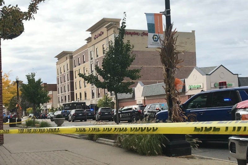 A deadly shooting and hours-long barricaded gunman situation at the Hampton Inn in Dearborn on Thursday did not start over a bill issue, the hotel chain said Friday night.