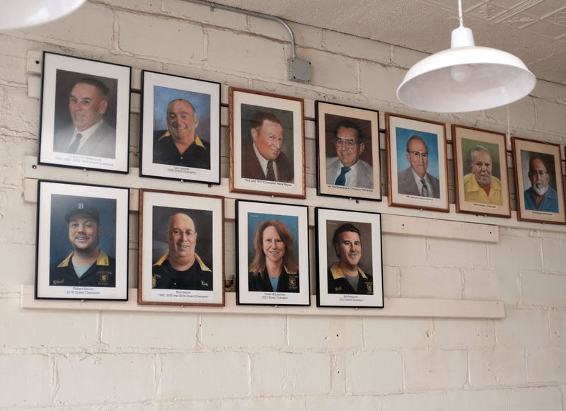 Portraits of feather bowling Grand Champions hang on the wall at the Cadieux Cafe